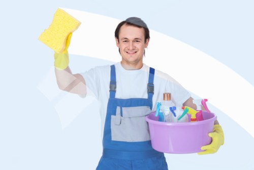 Local oven cleaner working in a compact Stockwell apartment kitchen
