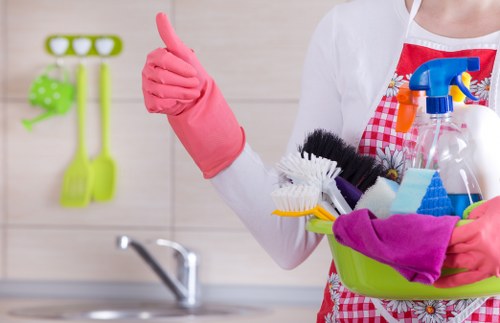 Local cleaner carrying out kitchen and bathroom cleaning in Stockwell